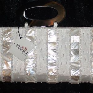 New with tags Mad by Design white clutch